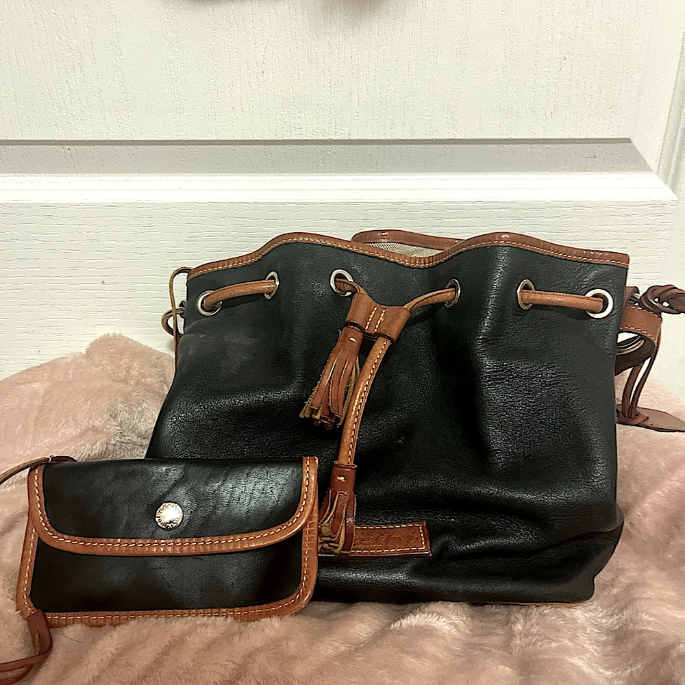 Black and brown Dooney & Bourke bucket bag with matching wallet